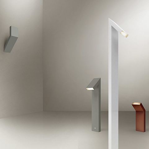 Chilone family: geometric LED fixtures in grey and copper, shown as wall sconce, floor bollard, and tall floor lamp versions