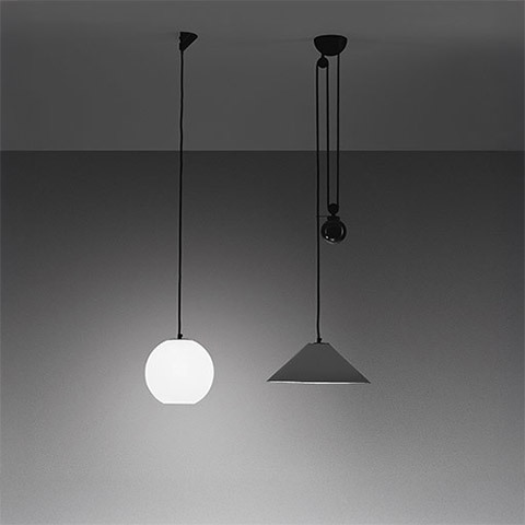 Artemide Aggregato pendant lamps: left opal white spherical globe, right dark conical shade with counterweight pulley on black cords
