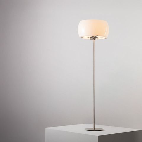 Artemide Clitunno floor lamp with opal white glass dome shade on a slender brushed metal stem and round base