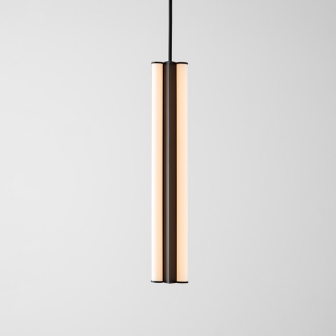 Artemide Dreispitz pendant lamp: slim cylindrical LED fixture with warm white diffuser panels and dark metal frame on black cord