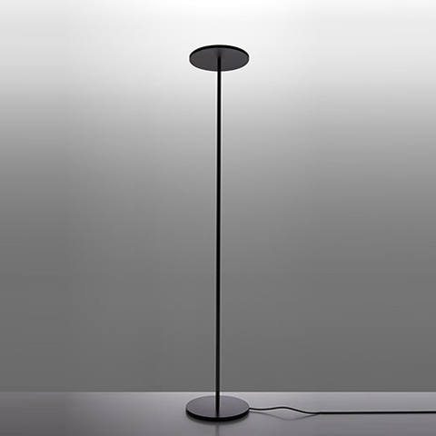 Athena black floor lamp by Artemide: slender vertical stem with circular disc diffuser on top and round weighted base