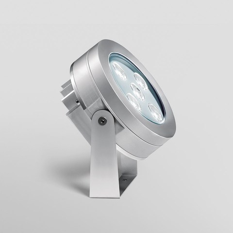 Artemide Ego Spot outdoor LED spotlight in brushed aluminum, mounted on adjustable ground spike, featuring multi-LED array with glass cover