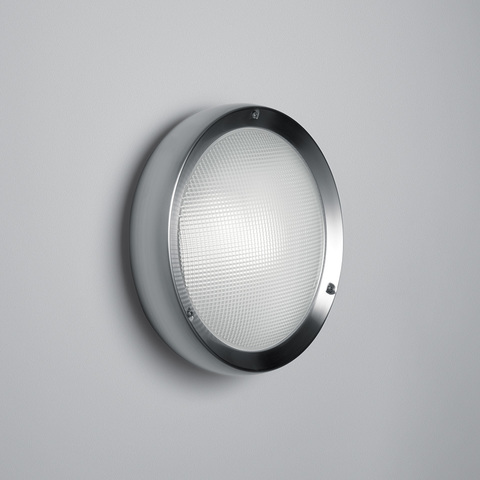 Artemide Niki round wall/ceiling light with textured white diffuser and polished chrome ring, designed for indoor and outdoor use