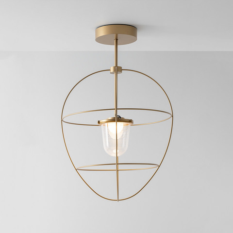 Artemide Nottola ceiling lamp: brushed brass oval frame with two rings encasing a ribbed glass diffuser on a central stem