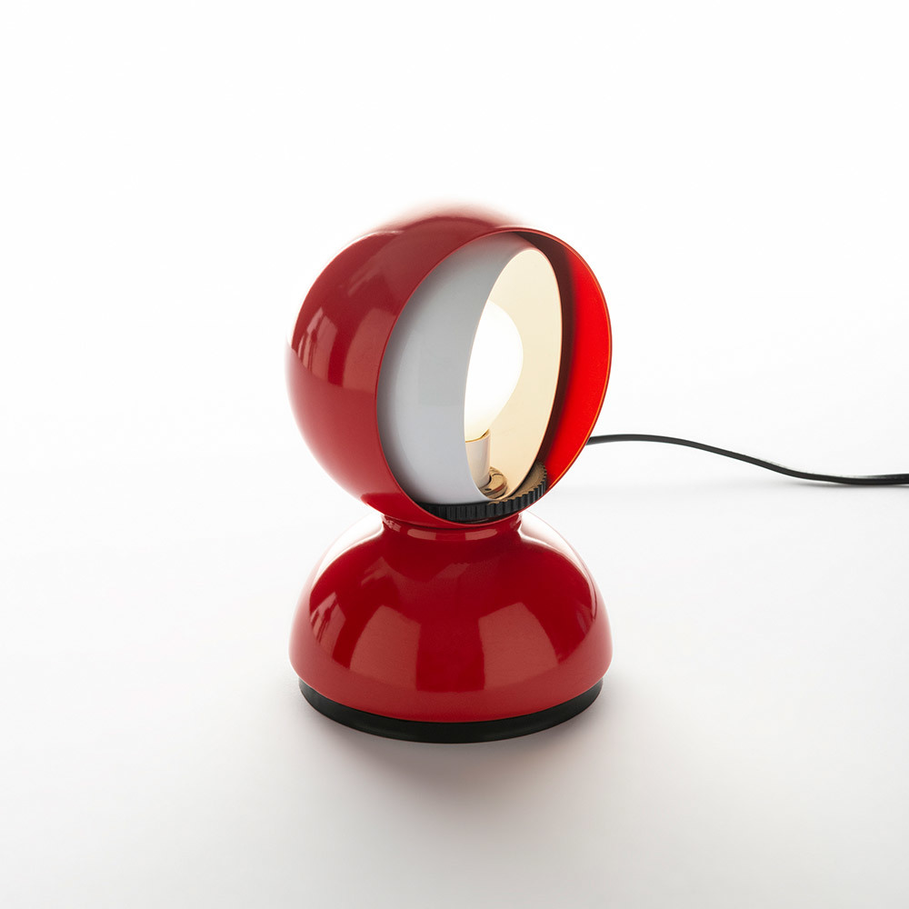 Eclisse table lamp with glossy red spherical shade and matching base.