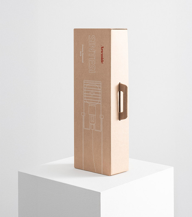 Cardboard Sintesi packaging box with white graphics, set against a light background.