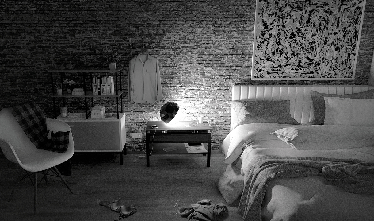 Bedroom with exposed brick wall featuring an Artemide table lamp on a coffee table, illuminating the space beside a bed.