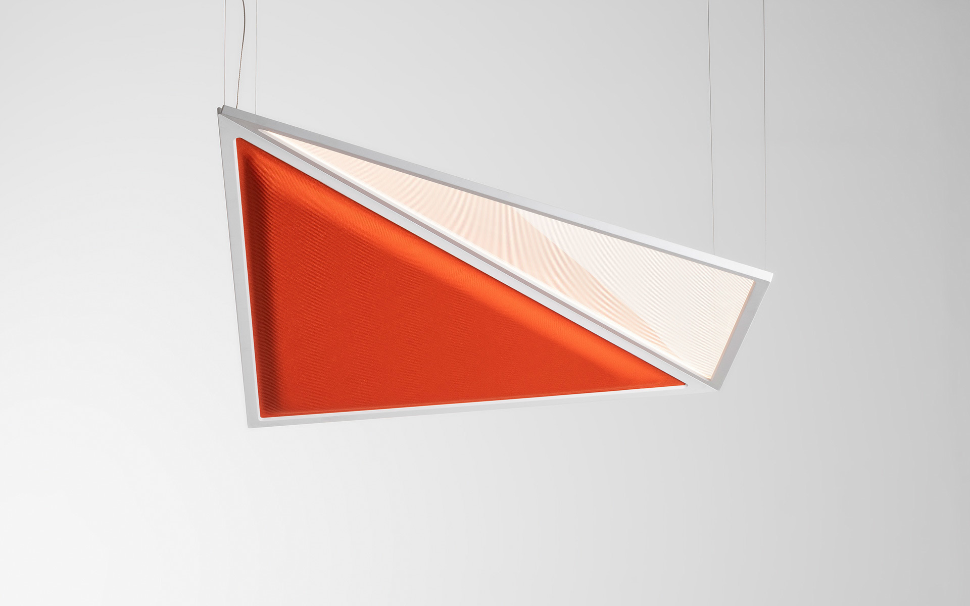 Artemide pendant lamp with triangular white frame, featuring an orange acoustic panel and illuminated translucent diffuser, suspended by cables
