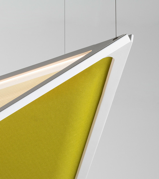 Close-up of a geometric pendant lamp with white angular frame, warm LED strip lighting, and yellow-green acoustic mesh panel