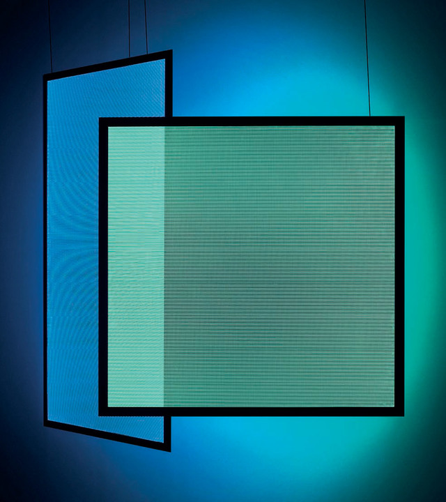 Two overlapping square pendant lamps with black frames emitting vibrant blue and teal light, creating a colorful ambient glow