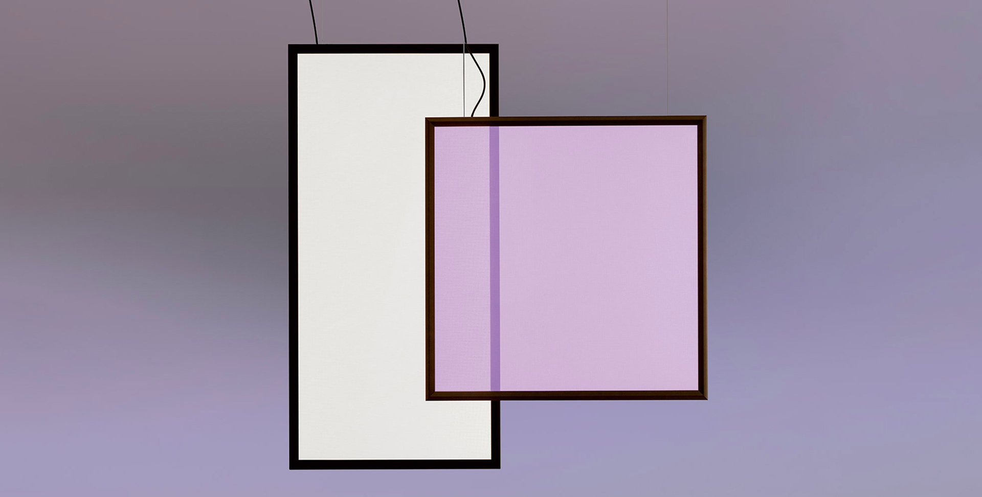 Two overlapping rectangular pendant lights: left white panel, right lavender-pink panel with dark frame, suspended by black cables