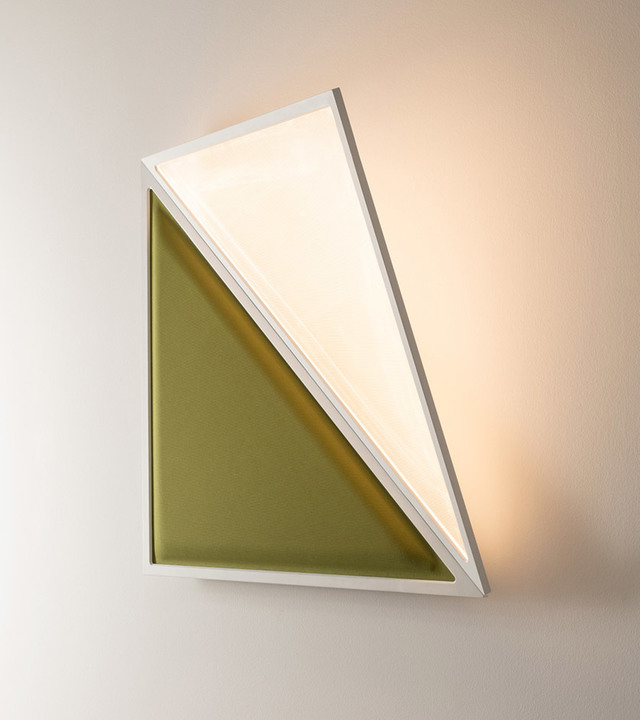 Wall lamp with geometric triangular design, white frame, olive green panel, and warm LED backlighting creating a soft glow