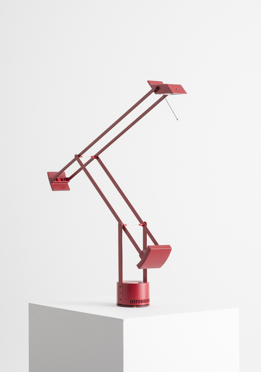 Artemide Tizio table lamp in deep red, featuring iconic counterbalanced articulated arms and rectangular head on cylindrical base