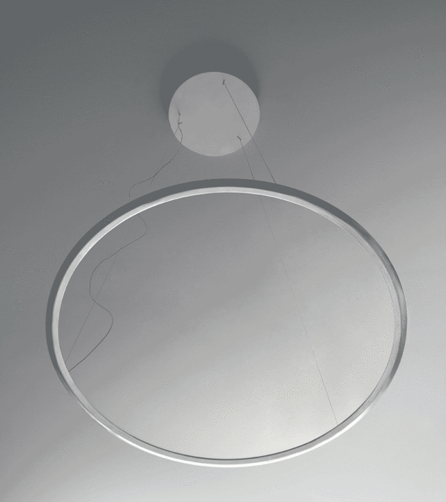Artemide circular LED pendant lamp in white, large ring-shaped diffuser suspended from ceiling by thin cables