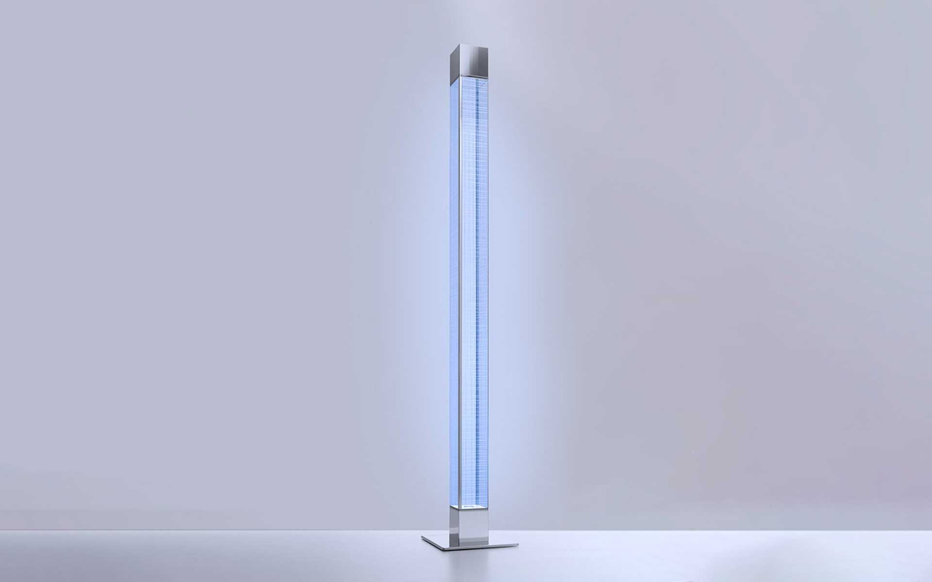 Tall slim floor lamp with vertical fluorescent tube emitting cool blue-white light, enclosed in a square aluminum profile on a flat base