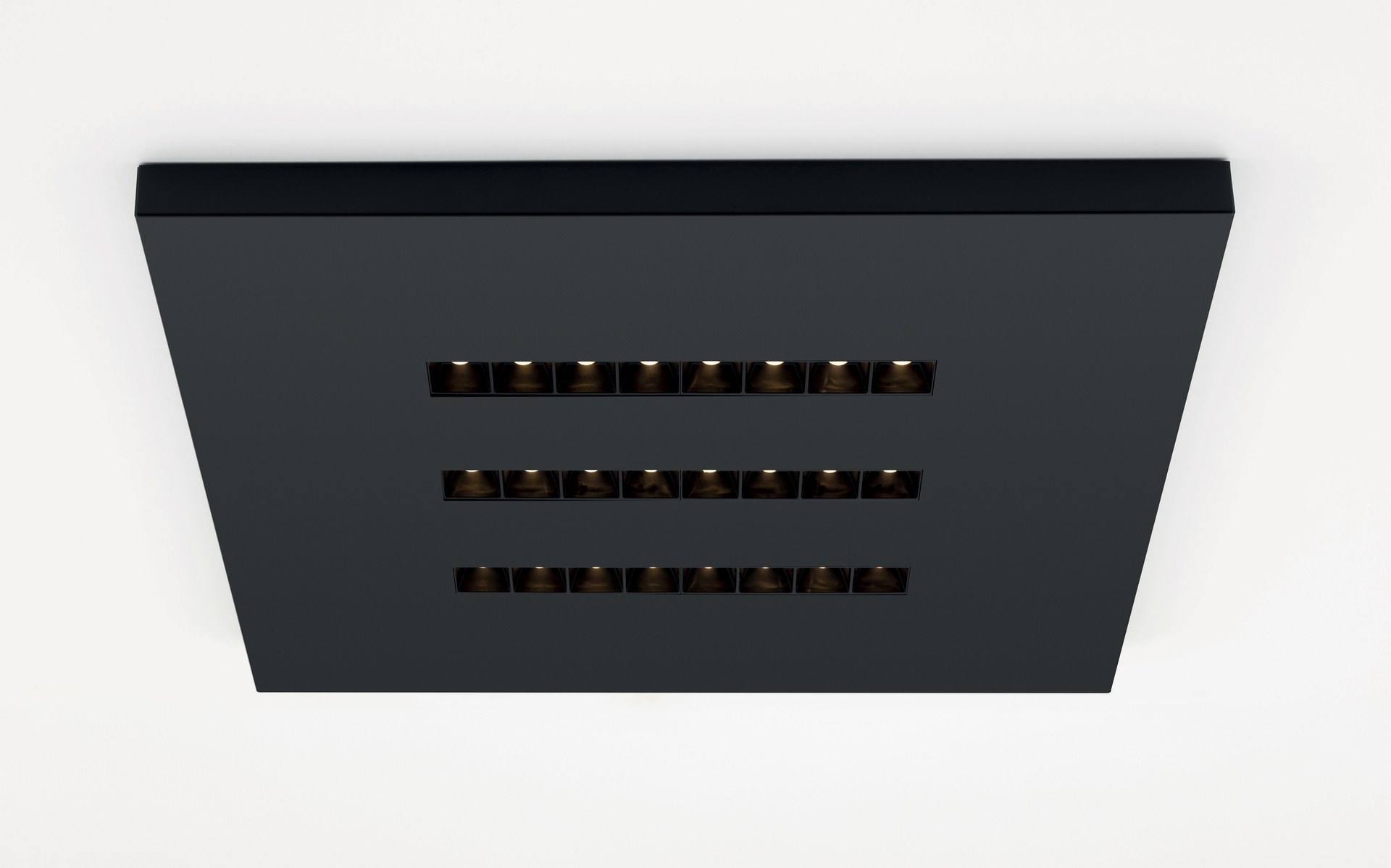 Black square ceiling light fixture with three rows of seven recessed LED modules, offering uniform and glare-free illumination