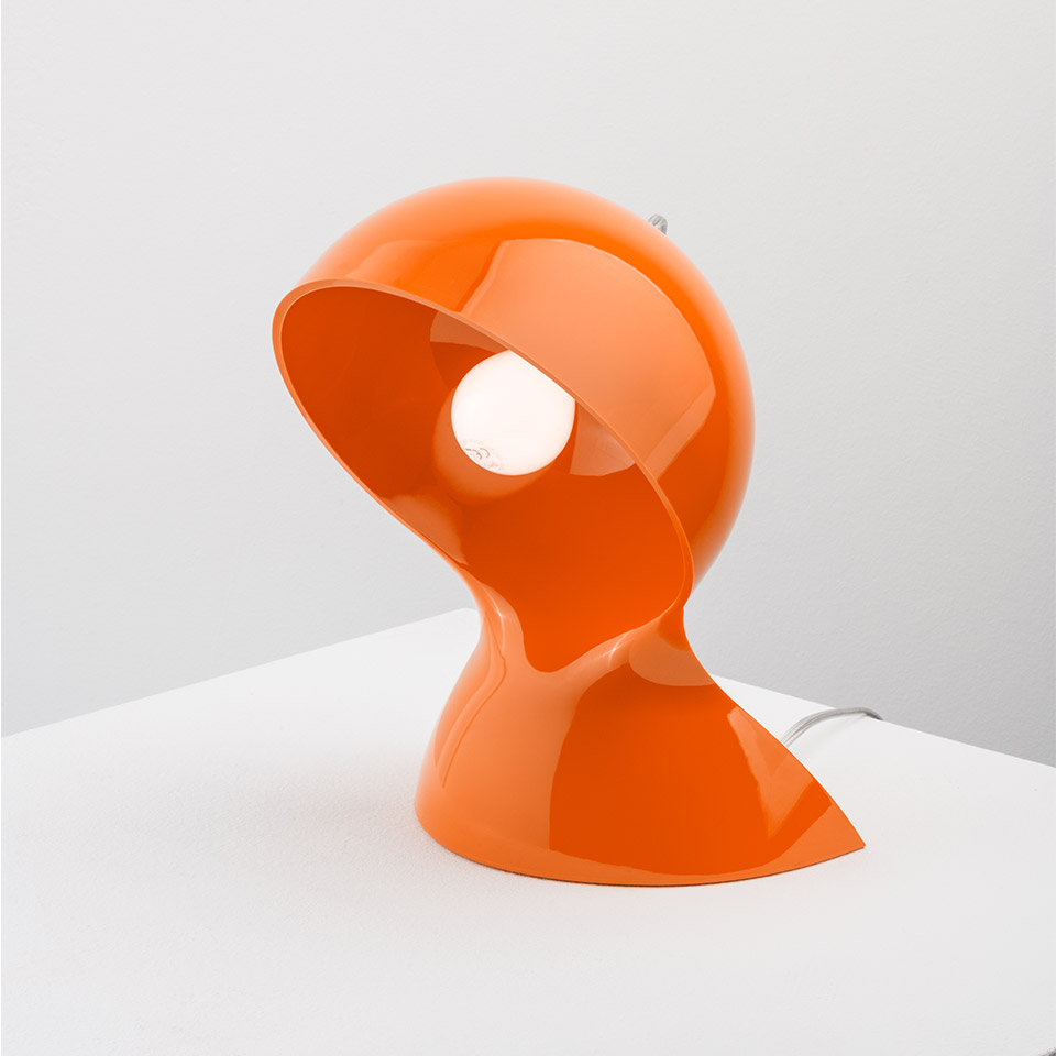 Artemide Dalù table lamp in glossy orange, featuring a spherical rotating shade on a sculpted base, exposing the bulb