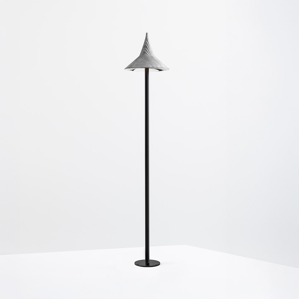 Artemide Unterlinden Outdoor floor lamp: tall black stem with round base, topped by a textured conical grey shade pointing upward