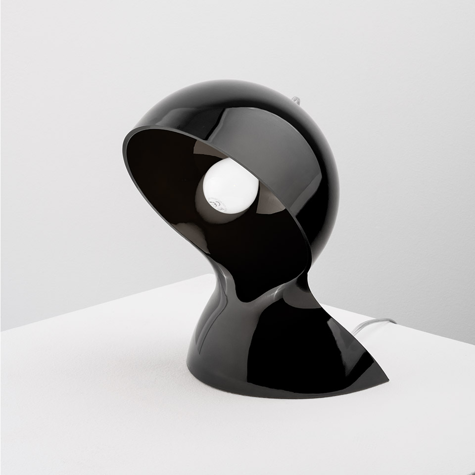 Artemide Dalù table lamp in glossy black, featuring a sculptural spherical shade with an open front revealing the bulb