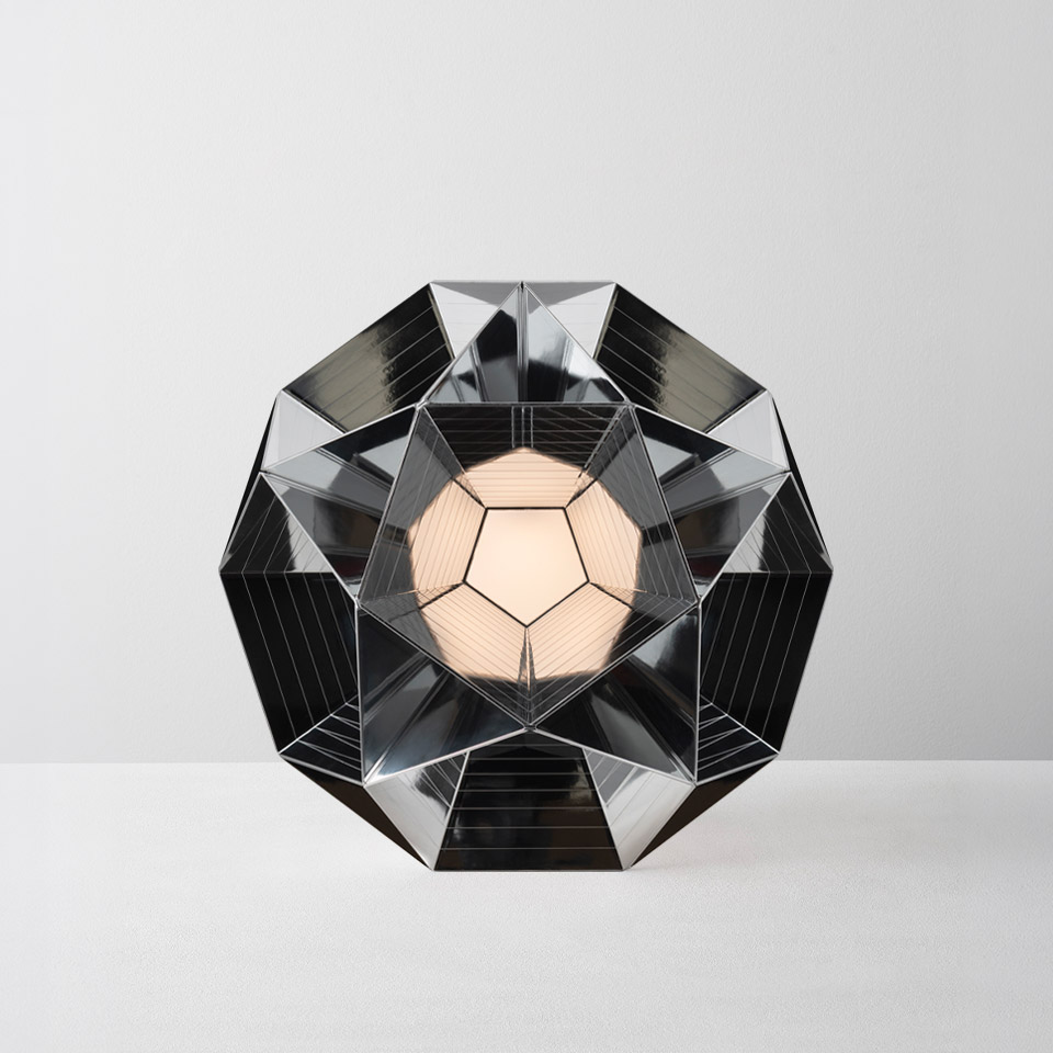 Artemide Arctic table lamp: geometric dodecahedron chrome structure with mirrored facets surrounding a central opal spherical light source