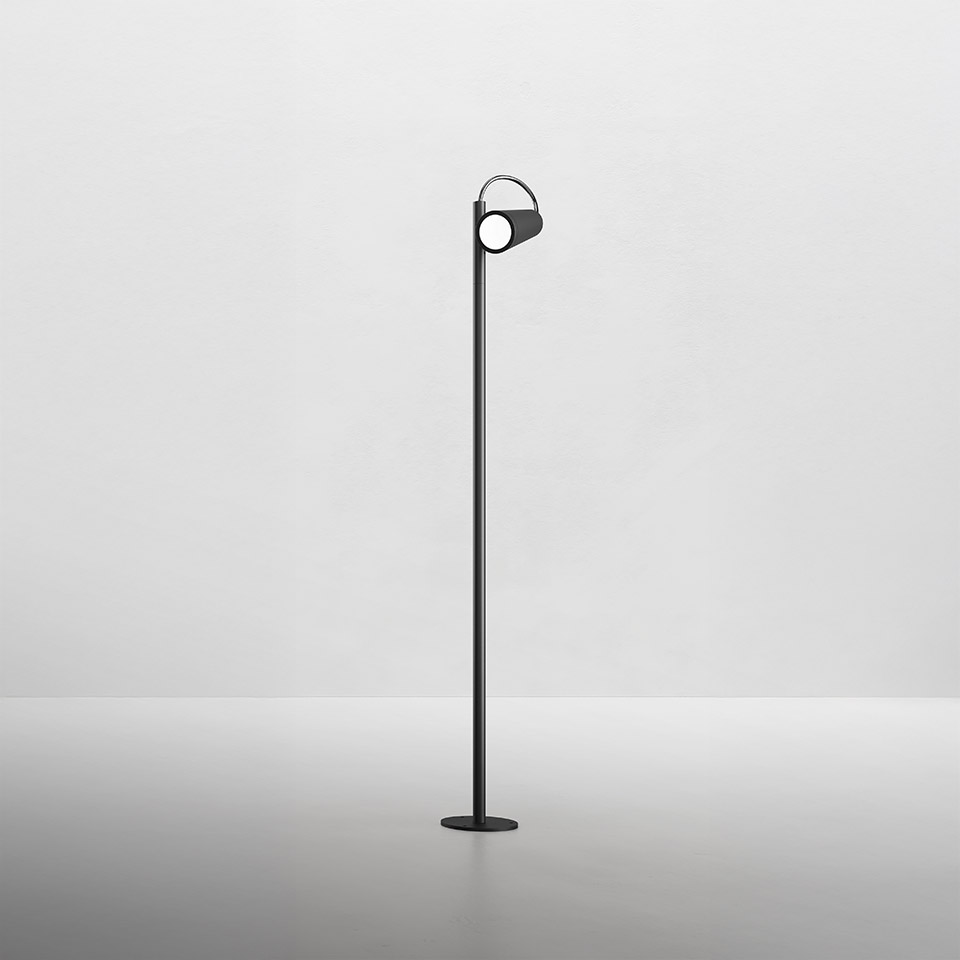 Artemide Conus floor lamp: slender black stem with circular base and adjustable cylindrical LED head on top
