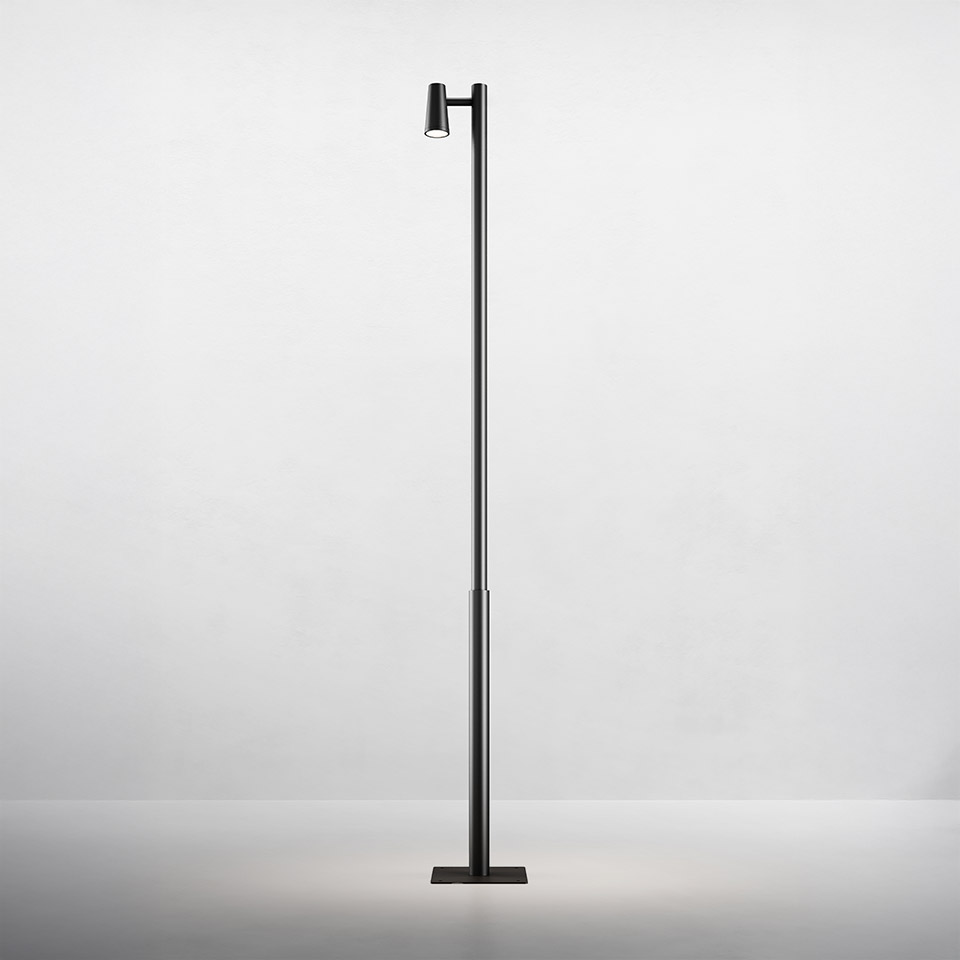 Artemide Conus floor lamp: tall slim black pole with single adjustable cylindrical LED spotlight near top, mounted on rectangular base
