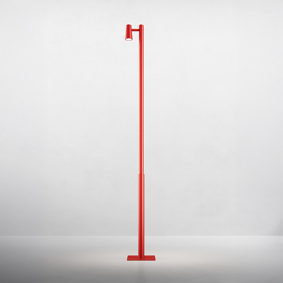 Artemide Conus floor lamp in red, featuring a tall slim pole with adjustable cylindrical spotlight head and flat rectangular base