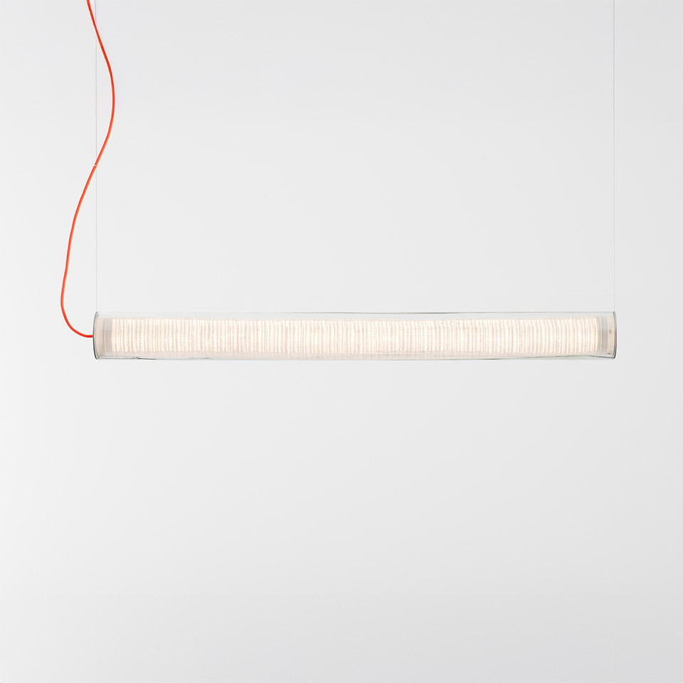 Artemide Criosfera pendant lamp: horizontal cylindrical clear glass tube with white ribbed inner diffuser, suspended by a red cable
