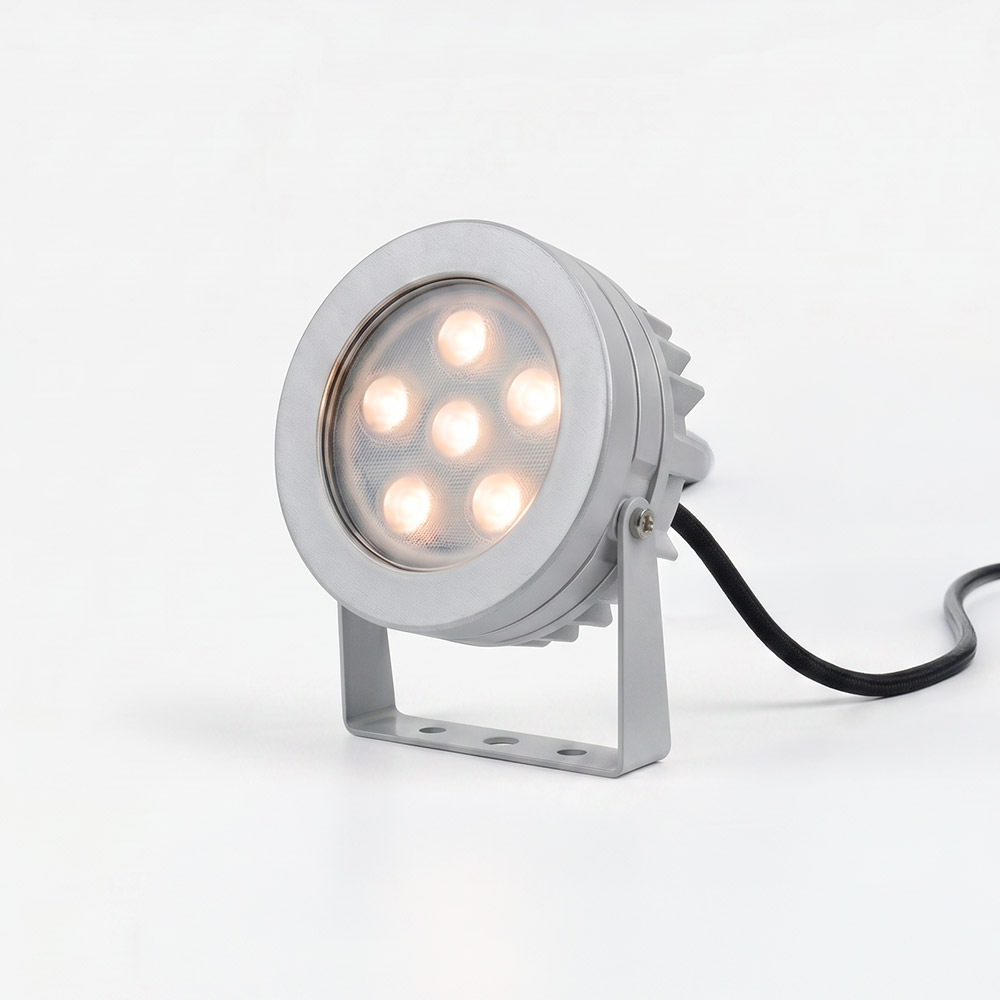 Artemide Ego Spot outdoor LED floodlight, round aluminum body with 6 warm LEDs, adjustable mounting bracket, black cable