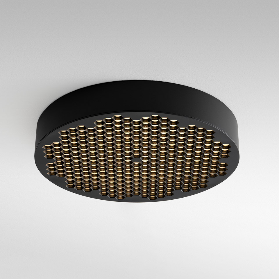 Artemide Helgoland ceiling lamp: round black body with a grid of small gold LED dots creating a warm, diffused light pattern