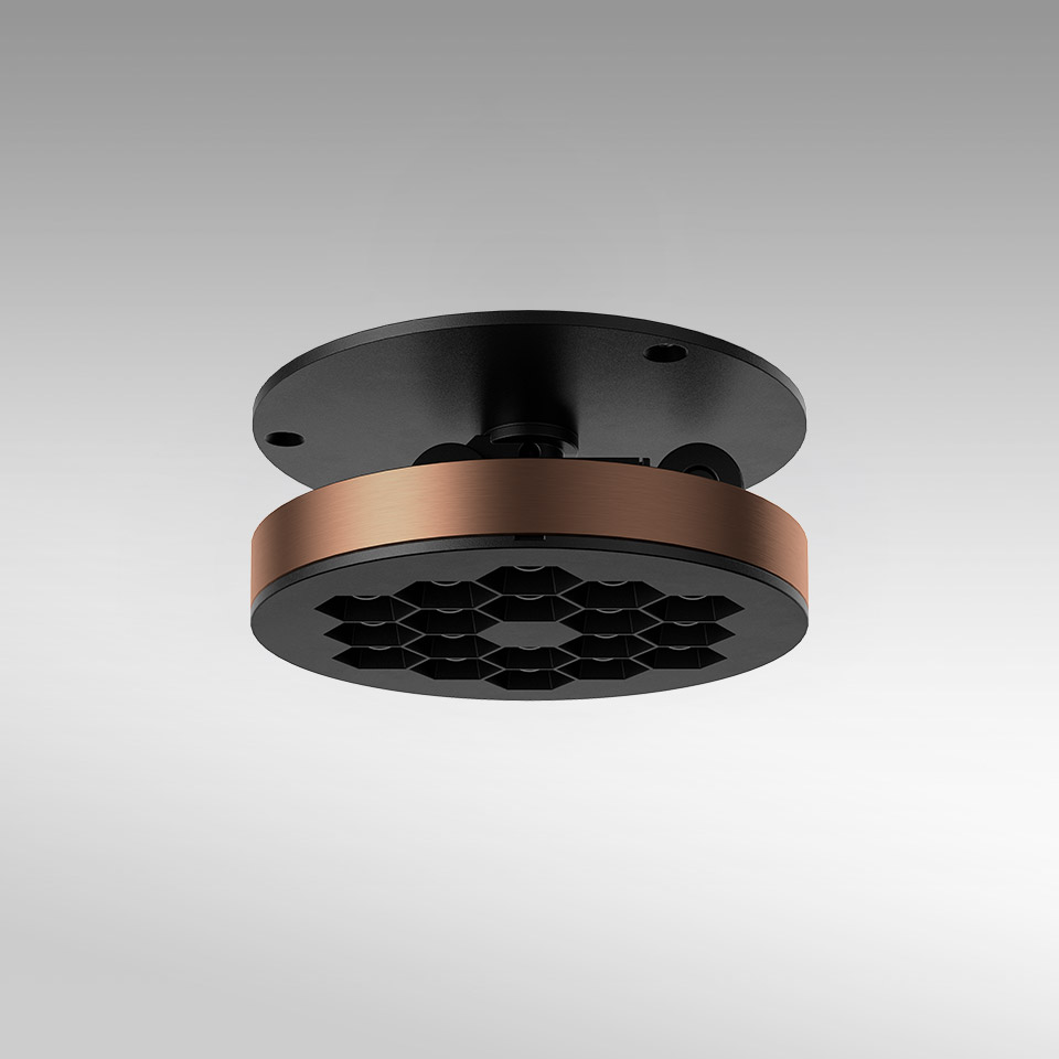 Artemide Helgoland Adjustable ceiling light: round black fixture with honeycomb diffuser and bronze accent ring, surface-mounted