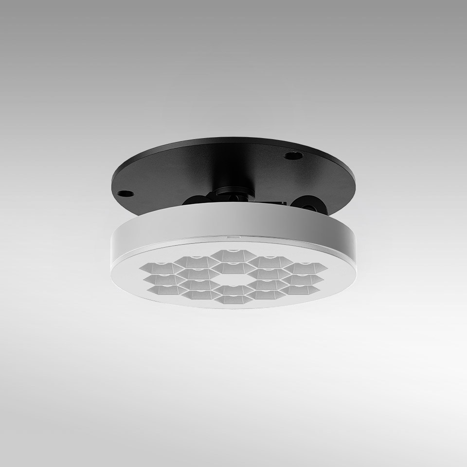 Artemide Helgoland Adjustable ceiling light: round white LED fixture with honeycomb optics and black mounting plate
