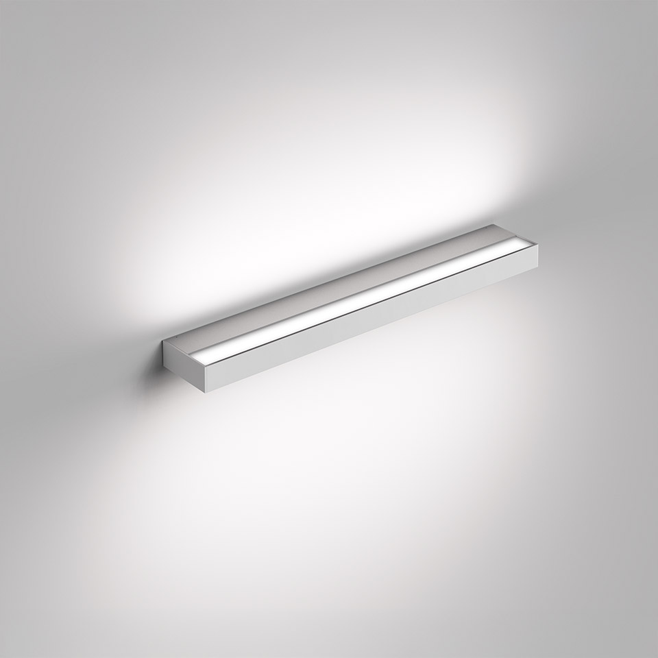 Artemide Hoy Parete wall lamp: sleek horizontal aluminum bar emitting soft direct and indirect LED light