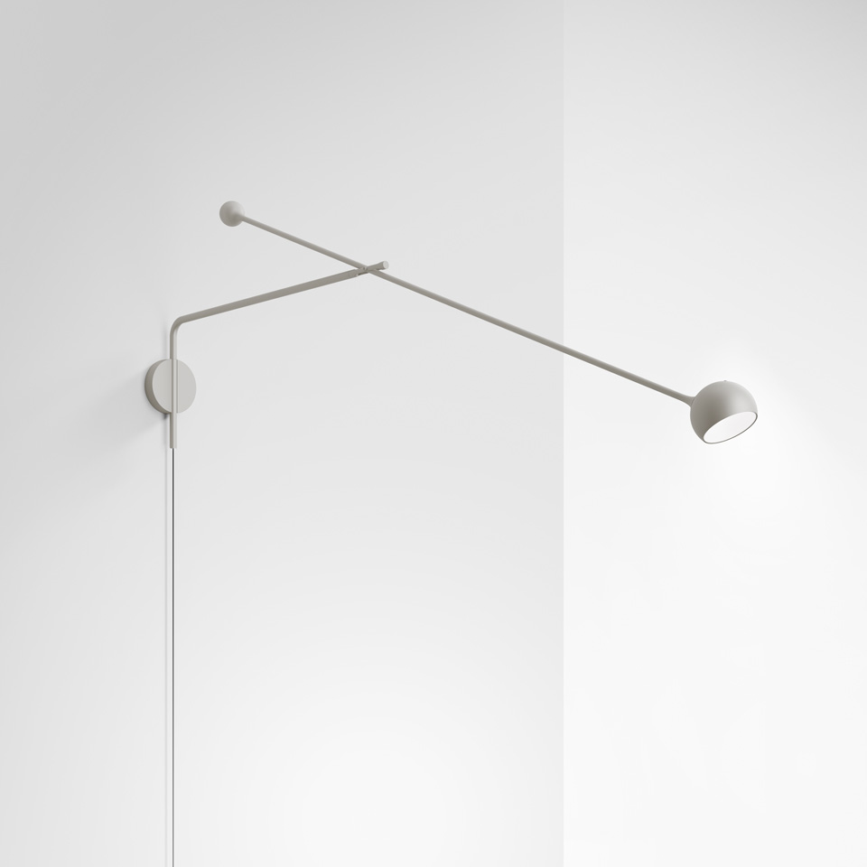 Artemide Ixa wall lamp in grey, featuring a long adjustable double-arm with counterbalance and small directional spotlight head