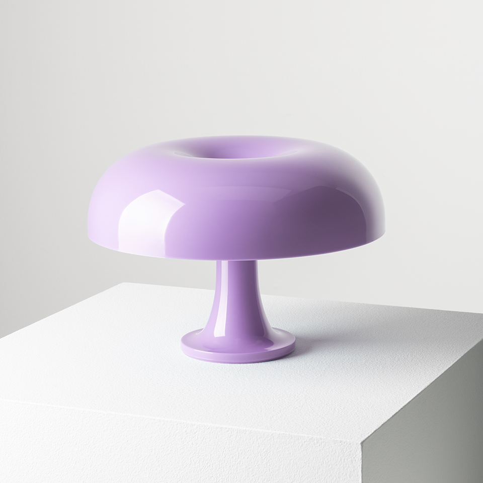 Artemide Nessino table lamp in lilac, featuring a glossy mushroom-shaped diffuser with toroidal top on a slender pedestal base
