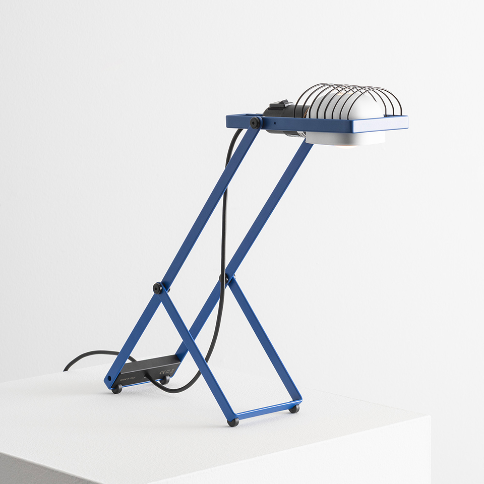Artemide Sintesi table lamp in blue with Z-shaped metal frame, adjustable white dome shade with protective grid, and black base