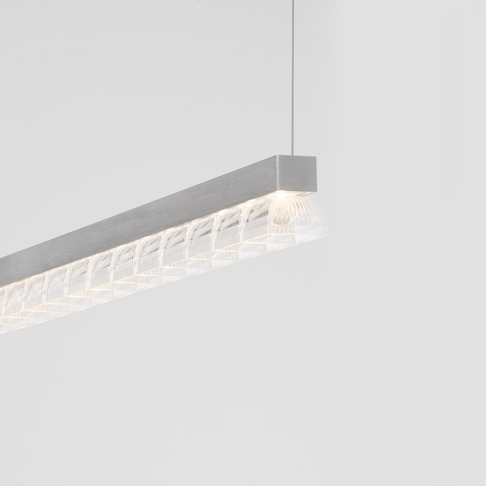 Artemide Somnĭum Stand Alone pendant lamp: sleek aluminum linear profile with decorative mesh diffuser, suspended by thin cable