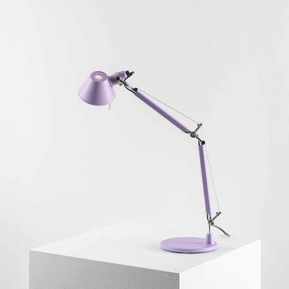 Artemide Tolomeo Micro Tavolo desk lamp in lilac, featuring adjustable articulated arm with tension cables and conical shade on round base