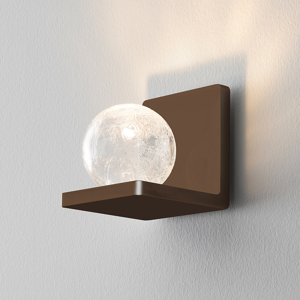 Artemide Ulrich und Diotima wall lamp: bronze square bracket holding a crackled glass sphere emitting warm LED light