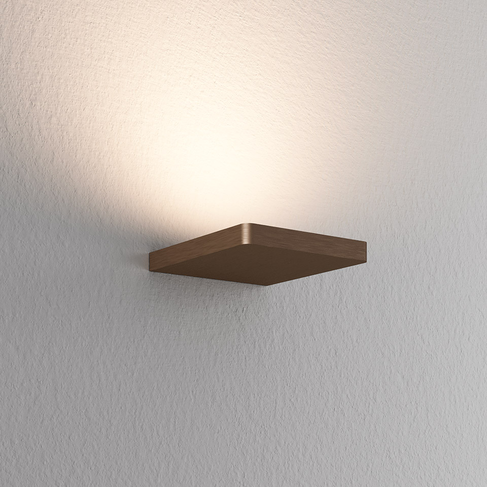 Artemide Ulrich und Diotima wall lamp: slim square bronze metal body mounted on wall, projecting warm upward light
