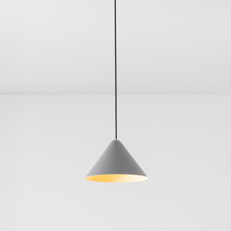Artemide Vea Suspension pendant lamp with conical grey exterior, warm gold interior shade, hanging from a black cord