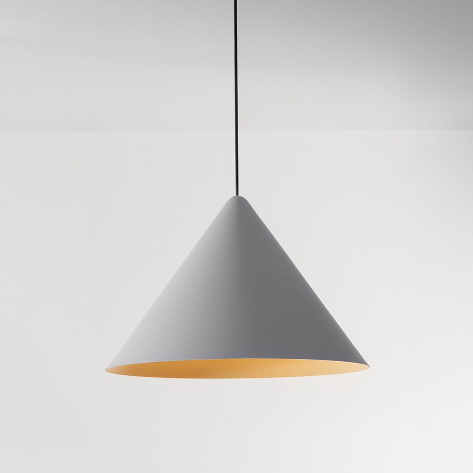Artemide Vea Suspension pendant lamp with grey conical shade, warm gold interior, hanging from a black cord