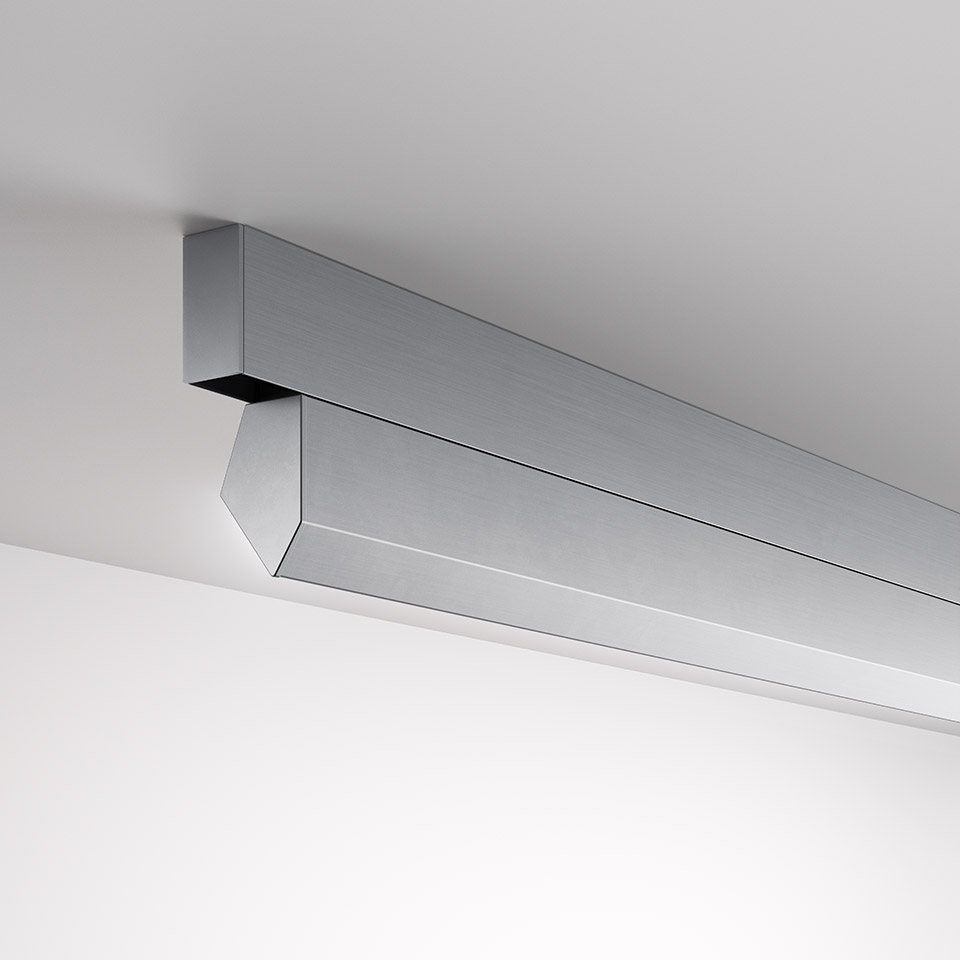 Artemide A.24 Wall Washer: sleek wall-mounted linear LED fixture in brushed aluminum, angled diffuser directing light downward along the wall