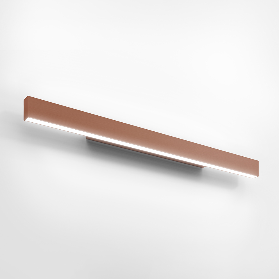 Artemide A.24 Parete wall lamp: slim horizontal LED bar in warm copper finish, emitting diffused light from bottom edge
