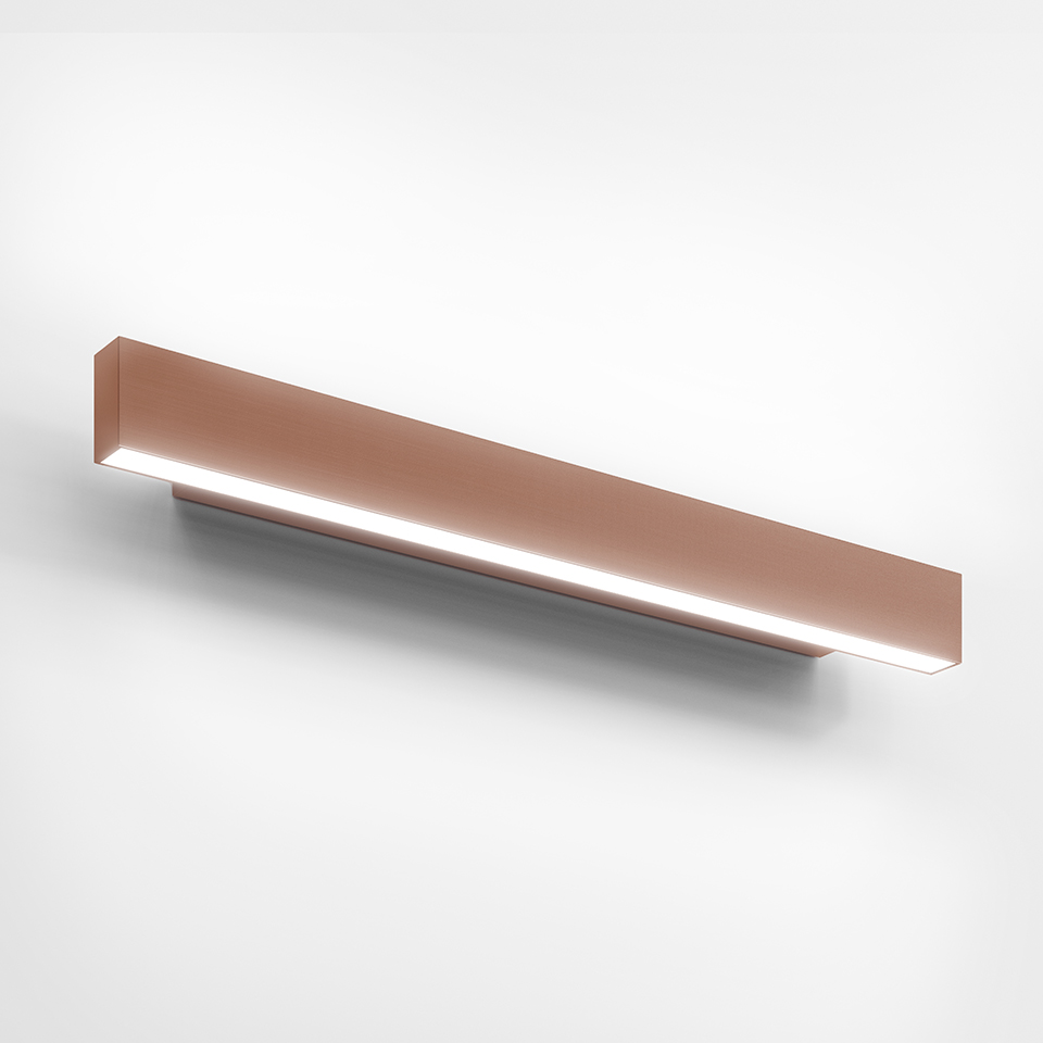Artemide A.24 Parete wall lamp: elongated rectangular copper-finish LED bar emitting diffused light from bottom slot