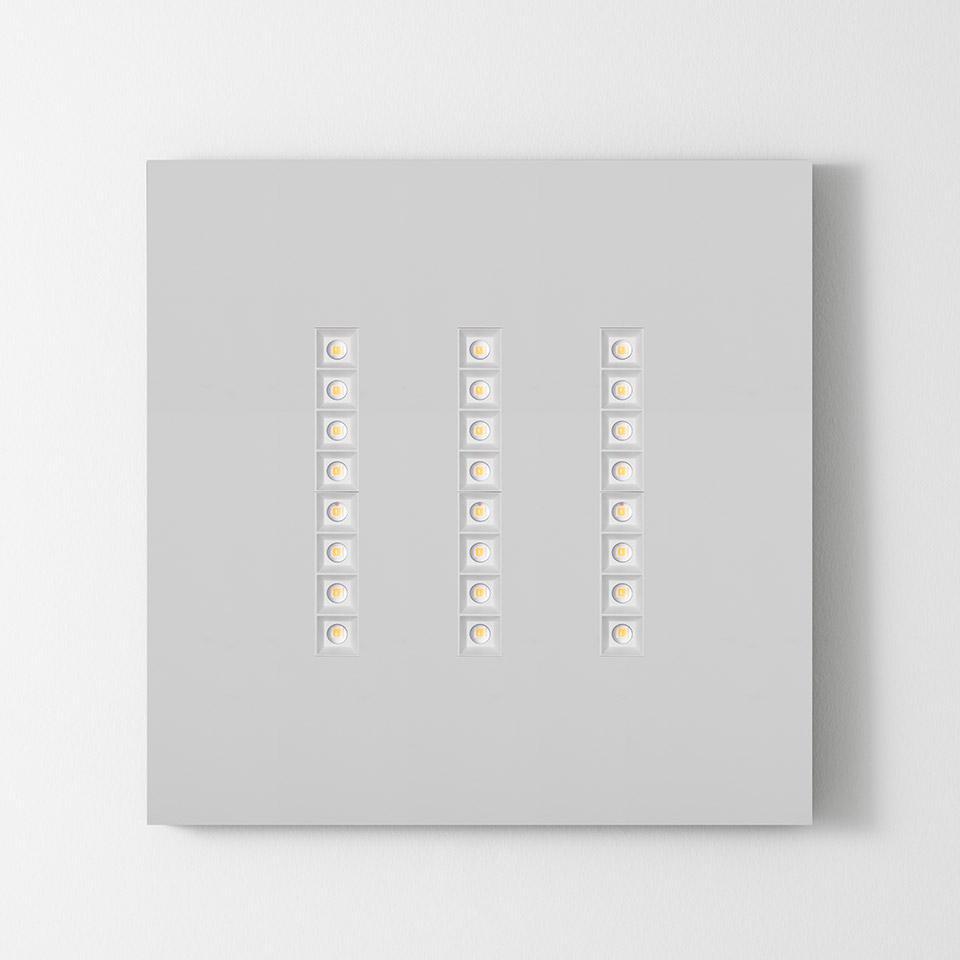 Artemide A.39 Refractive Square ceiling light with three vertical rows of seven square LED modules on a white panel