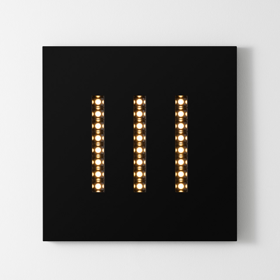 Artemide A.39 Refractive Square wall light: black square panel with three vertical LED strips emitting warm white light
