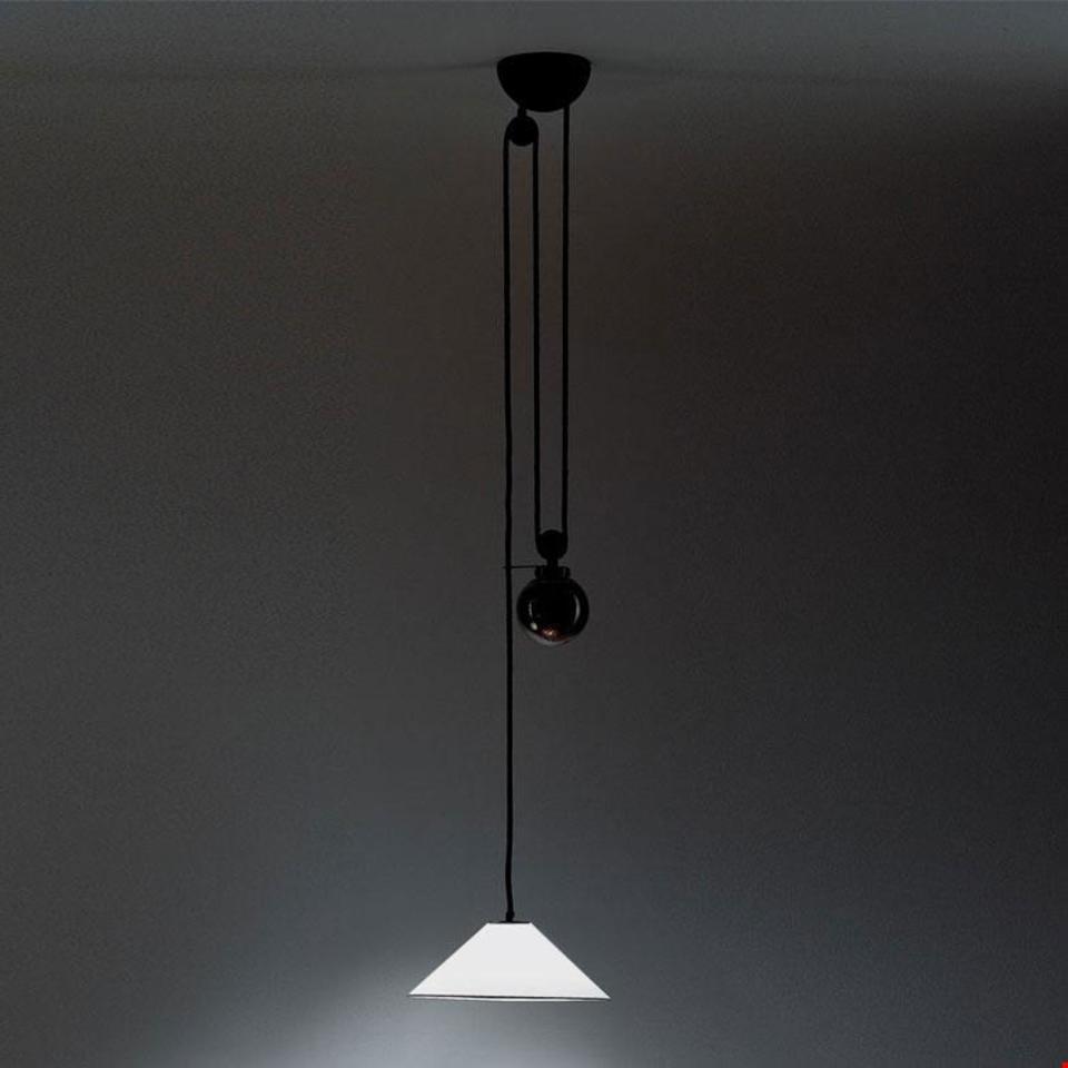 Aggregato pendant lamp by Artemide: white conical shade suspended by black cord with counterweight pulley mechanism on dark ceiling