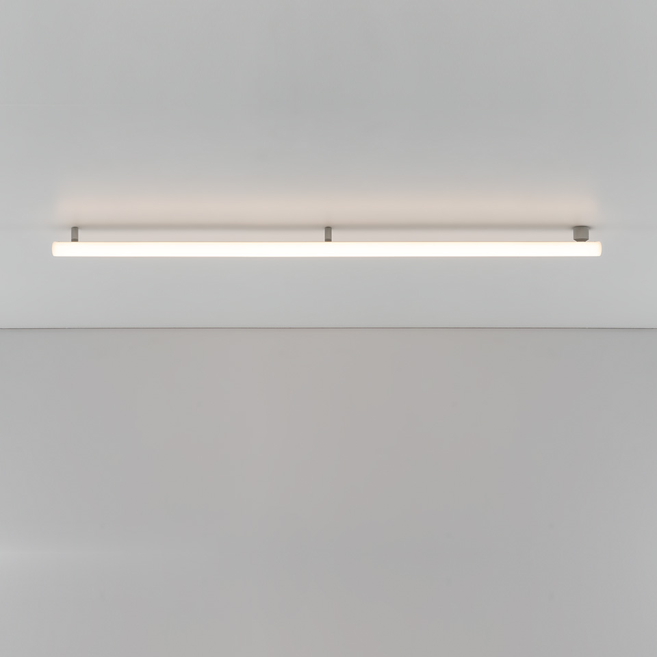 Artemide Alphabet of Light Linear ceiling lamp: long horizontal white opal diffuser mounted flush on ceiling with metal brackets