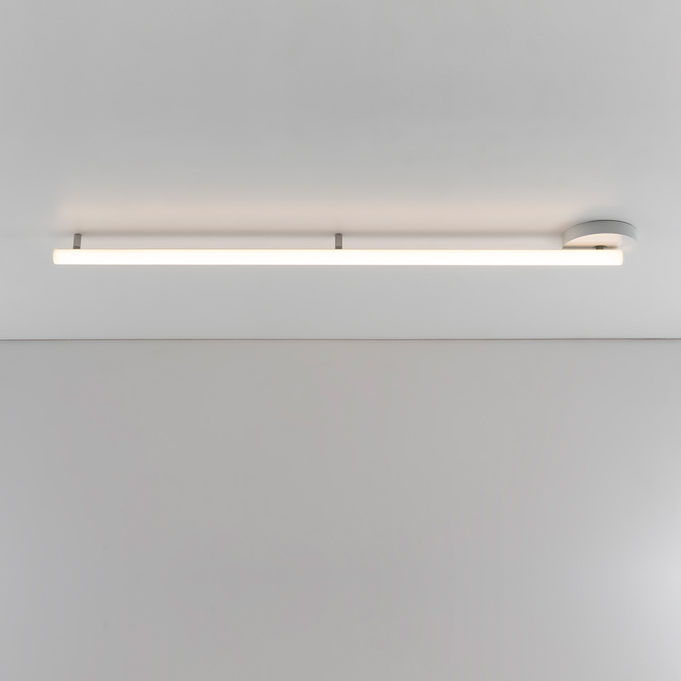 Artemide Alphabet of Light Linear ceiling lamp: slim white LED bar mounted flush on ceiling with circular wall connector